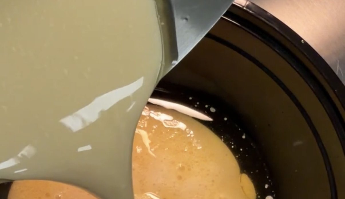 Slow-simmered broth poured into the pot